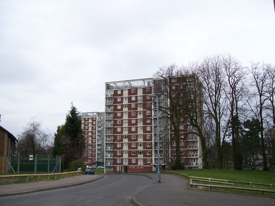 Tower block flats behind trees and a park in Erdington, Birmingham